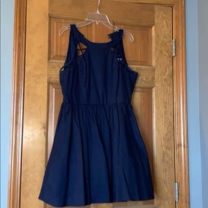 a navy blue dress with cutout details